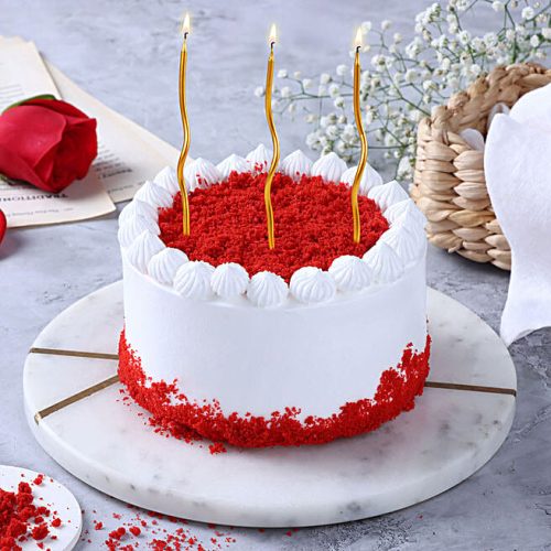 Festive Red Cream Cake with Swirl Candles - Image 3